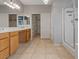 Bathroom featuring double vanity, walk-in closet, and glass shower at 640 Finch Island Ave, Henderson, NV 89015