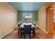 Dining room featuring modern chandelier, wood floors, and a neutral color palette at 640 Finch Island Ave, Henderson, NV 89015