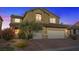 Inviting two-story home with lush landscaping, mature tree, and attached two-car garage at 640 Finch Island Ave, Henderson, NV 89015