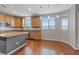 Bright kitchen with wooden cabinets, stainless steel appliances, island, and natural light at 640 Finch Island Ave, Henderson, NV 89015