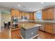 Well-equipped kitchen boasting stainless steel appliances and a granite-topped center island at 640 Finch Island Ave, Henderson, NV 89015
