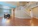 Open-concept floorplan featuring a staircase, wood floors, and a dining area at 640 Finch Island Ave, Henderson, NV 89015