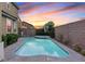 Inviting backyard pool and spa, perfect for relaxation and entertaining beneath evening skies at 640 Finch Island Ave, Henderson, NV 89015