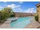Private backyard oasis features a sparkling pool, spa, and lush landscaping at 640 Finch Island Ave, Henderson, NV 89015