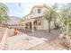 Private backyard featuring a covered patio and brick paved walkway at 6630 Cave Rock Ave, Las Vegas, NV 89110