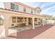 Backyard patio with a built-in shade structure, seating, and barbecue at 6630 Cave Rock Ave, Las Vegas, NV 89110