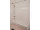 Clean bathroom with a tub and shower combination and tiled walls at 6630 Cave Rock Ave, Las Vegas, NV 89110