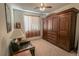 Cozy bedroom featuring a large armoire, comfortable seating, and soft lighting at 6630 Cave Rock Ave, Las Vegas, NV 89110