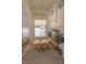 Dining room with high ceilings, large window, and a wooden table with six chairs at 6630 Cave Rock Ave, Las Vegas, NV 89110