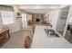Bright kitchen offering island with seating, a dining area and view into the living area at 6630 Cave Rock Ave, Las Vegas, NV 89110