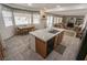 Open kitchen showcases island with bar seating, dining area, and seamless transition to living space at 6630 Cave Rock Ave, Las Vegas, NV 89110