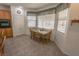 The eat-in kitchen has stainless appliances and a cozy dining table with windows at 6630 Cave Rock Ave, Las Vegas, NV 89110