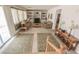Comfortable living room featuring built-in shelving, neutral tones, and plenty of natural light at 6630 Cave Rock Ave, Las Vegas, NV 89110