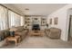 Cozy living room features built-in shelving, neutral tones, and plenty of natural light through the window at 6630 Cave Rock Ave, Las Vegas, NV 89110