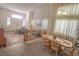 Open living space with large windows, high ceilings, and a seamless flow between rooms at 6630 Cave Rock Ave, Las Vegas, NV 89110