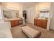 Large main bathroom with dual vanities, mirrors, ample counter space, and a bench for seating at 6630 Cave Rock Ave, Las Vegas, NV 89110