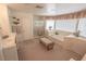 Spacious main bathroom with a bathtub, separate shower, dual vanities, and carpeted flooring at 6630 Cave Rock Ave, Las Vegas, NV 89110