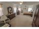 Generously sized main bedroom with carpet flooring, ceiling fan, natural light, and furniture sets at 6630 Cave Rock Ave, Las Vegas, NV 89110