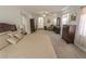 Bright and airy main bedroom with furniture set and carpet flooring throughout at 6630 Cave Rock Ave, Las Vegas, NV 89110