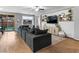 Bright living room with a large comfortable couch, hardwood floors and lots of natural light at 817 Great Sky Ct, North Las Vegas, NV 89084