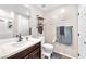 Bathroom featuring a modern vanity, neutral walls, and decorative wall art at 8507 Insignia Ave # 102, Las Vegas, NV 89178