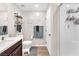 Stylish bathroom featuring a shower, single sink, and decorative shelves at 8507 Insignia Ave # 102, Las Vegas, NV 89178