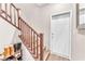 Inviting entryway with staircase, door, and convenient shoe storage at 8507 Insignia Ave # 102, Las Vegas, NV 89178