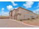 Attractive townhouse exterior with well-maintained landscaping and a brick-paved driveway at 8507 Insignia Ave # 102, Las Vegas, NV 89178