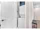 This is a laundry space with a stacked washer and dryer next to the entry door at 8507 Insignia Ave # 102, Las Vegas, NV 89178