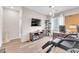 Bright office space featuring wood floors, a large TV, and a modern chandelier at 8507 Insignia Ave # 102, Las Vegas, NV 89178