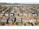 An aerial view of a residential neighborhood shows well-maintained homes in a suburban setting at 8675 Principato St, Las Vegas, NV 89166