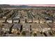 An aerial view of a residential neighborhood shows well-maintained homes in a suburban setting at 8675 Principato St, Las Vegas, NV 89166