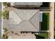 An aerial view shows a roof and a manicured backyard in a well-planned neighborhood at 8675 Principato St, Las Vegas, NV 89166