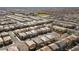 Wide aerial shot displaying the repetitive yet orderly arrangement of houses within a planned community at 8675 Principato St, Las Vegas, NV 89166