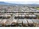 High-angle aerial view of a dense residential neighborhood featuring similar-style homes and manicured landscaping at 8675 Principato St, Las Vegas, NV 89166