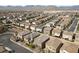 Expansive aerial view of a well-planned community with mountain backdrop and diverse housing options at 8675 Principato St, Las Vegas, NV 89166