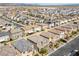 An aerial view shows well-maintained homes with desert landscaping and a pool at 8675 Principato St, Las Vegas, NV 89166