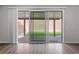 View from inside showcasing sliding glass doors leading to a patio and backyard at 8675 Principato St, Las Vegas, NV 89166