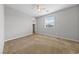 Bedroom featuring neutral walls, plush carpet, a ceiling fan and a window at 8675 Principato St, Las Vegas, NV 89166