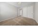 Bedroom featuring neutral walls, plush carpet and a closet with sliding doors at 8675 Principato St, Las Vegas, NV 89166