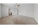 Large bedroom with plush carpeting, ceiling fan, and walk-in closet, offering comfort and ample space at 8675 Principato St, Las Vegas, NV 89166