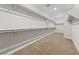 Spacious walk-in closet boasting ample shelving and rod space, perfect for organized storage at 8675 Principato St, Las Vegas, NV 89166