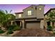 Attractive two-story home with a two car garage, landscaped front yard, and stylish architectural details at 8675 Principato St, Las Vegas, NV 89166