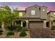 Beautiful home exterior, virtually staged, featuring a cozy front porch and a manicured front yard at 8675 Principato St, Las Vegas, NV 89166