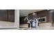 Close-up of a kitchen featuring stainless steel appliances and modern fixtures at 8675 Principato St, Las Vegas, NV 89166