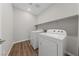 Functional laundry room equipped with a modern washer, dryer, and convenient shelving at 8675 Principato St, Las Vegas, NV 89166