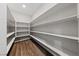 Pantry with plentiful shelving for optimal storage, complemented by attractive wood flooring at 8675 Principato St, Las Vegas, NV 89166