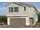 Charming two-story home featuring a stucco exterior, tiled roof, and an attached one car garage at 9076 Rivington Ave, Las Vegas, NV 89148