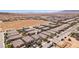 A desirable community featuring desert landscaping with new construction in the background and mountains in the distance at 9625 W Meranto Ave, Las Vegas, NV 89178