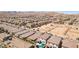 A Gathering friendly Primary-planned community featuring desert landscaping with new construction in the background at 9625 W Meranto Ave, Las Vegas, NV 89178